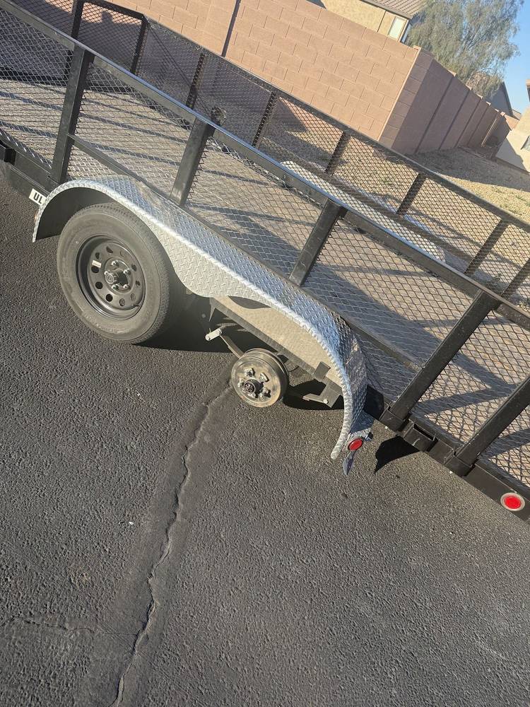 Utility trailer with ramp gate after repair